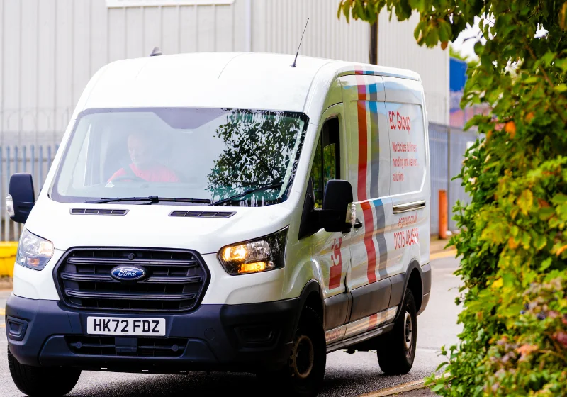 An image of an EC Group branded van leaving the warehouse and head office of EC Group