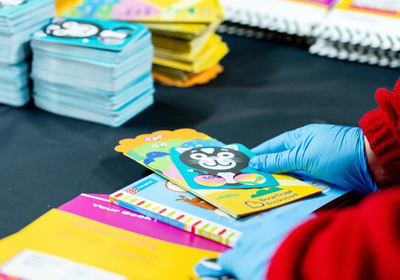 An image of leaflets, programmes, and material provided by BookTrust to be packed and fulfilled by EC Group