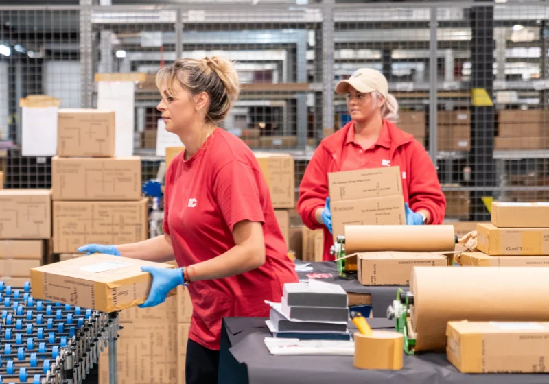 An EC Group employee handles The Folio Society's packaged goods