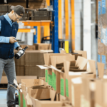 An EC Group employee helps Decanter's warehousing